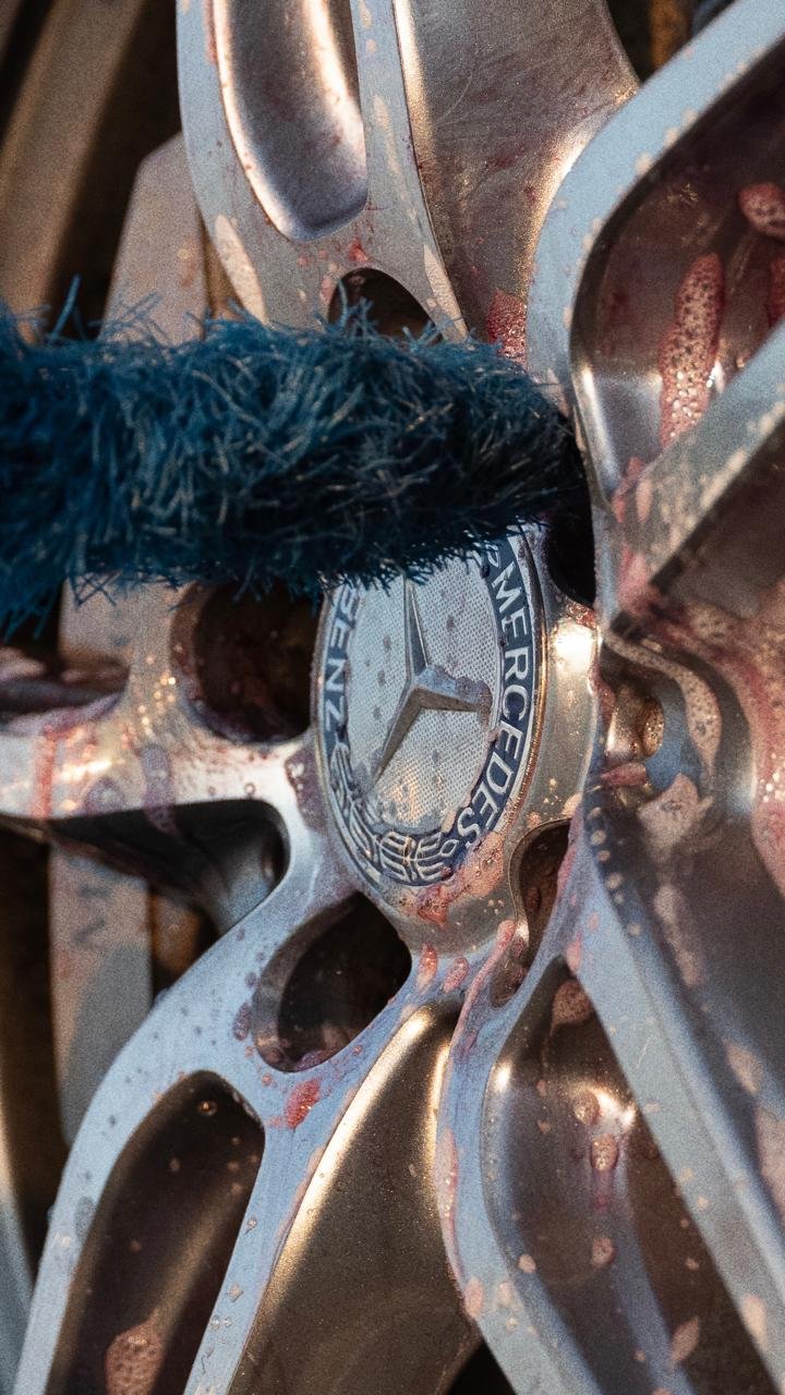 Detailing brush cleaning Mercedes wheel rim